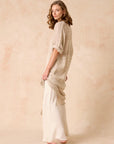 Woman Wearing Estilo Emporio Neve Linen Dress -Tela Atena Panna - Dress LUXAMORE
