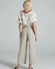 Estilo Emporio Linen Pant Riviera worn by model in natural setting LUXAMORE 