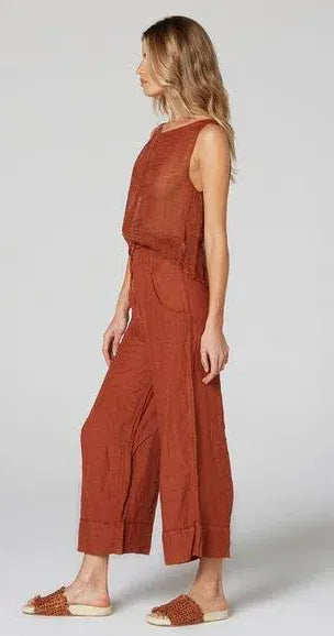 Estilo Emporio Linen Pant Tropez - Rust worn by model in natural setting LUXAMORE 