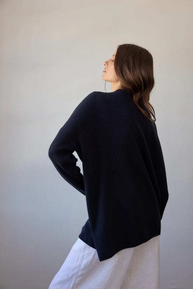 Estilo Emporio Zoe Cashmere - Navy sustainable knit worn by model in studio LUXAMORE  