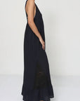 Linen Dress Black Maxi Lace Back Made in Italy worn by model in natural setting LUXAMORE 