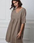 Linen Babydoll Dress Made in Italy - Taupe worn by model in natural setting LUXAMORE 