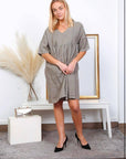 Linen Babydoll Dress Made in Italy - Taupe worn by model in natural setting LUXAMORE 