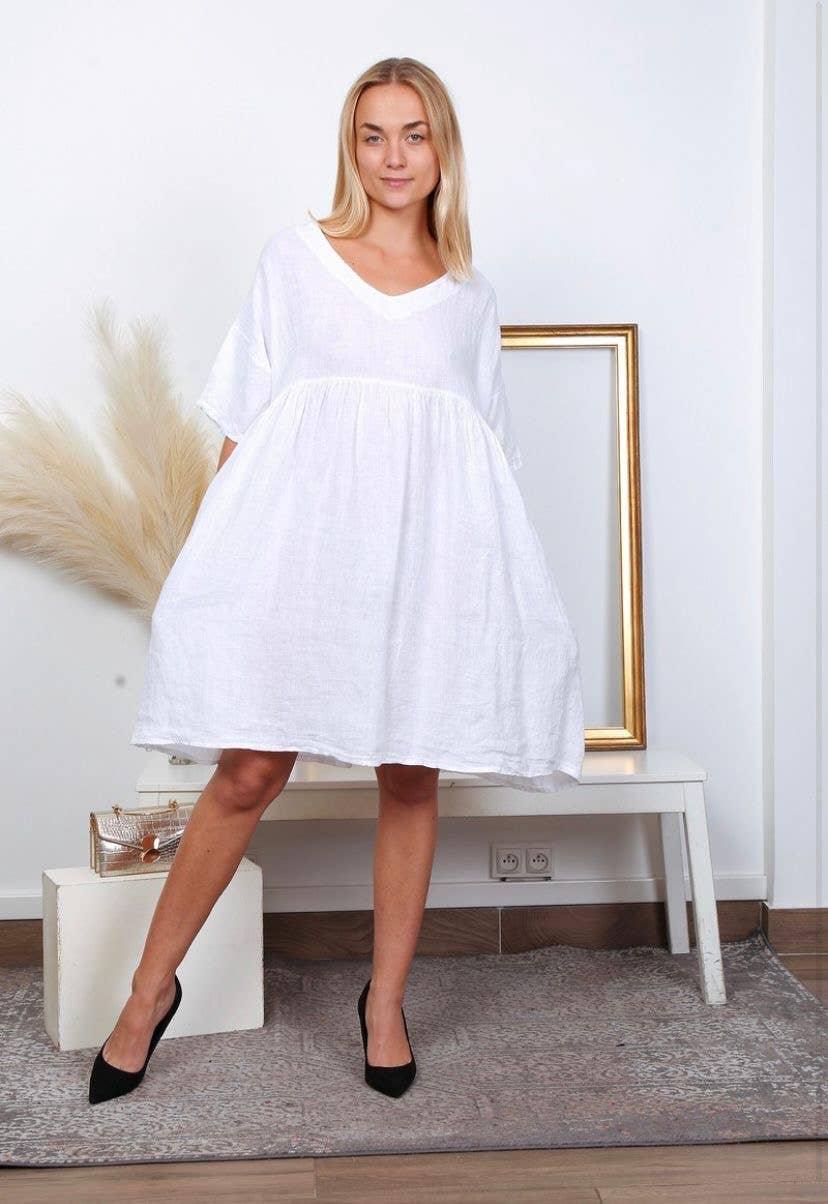 Linen Babydoll Dress Made in Italy - Taupe worn by model in natural setting LUXAMORE 