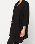 Linen Shirt Relaxed Oversized Button Front Pockets made in Italy Black worn by model in natural setting LUXAMORE 