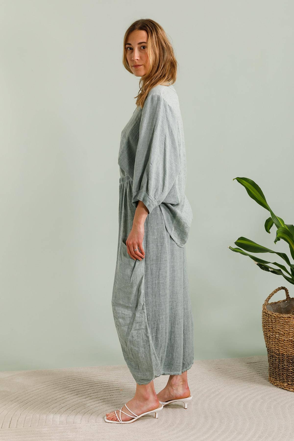 Linen Trousers made in Italy Charcoal Grey worn by model in natural setting LUXAMORE 