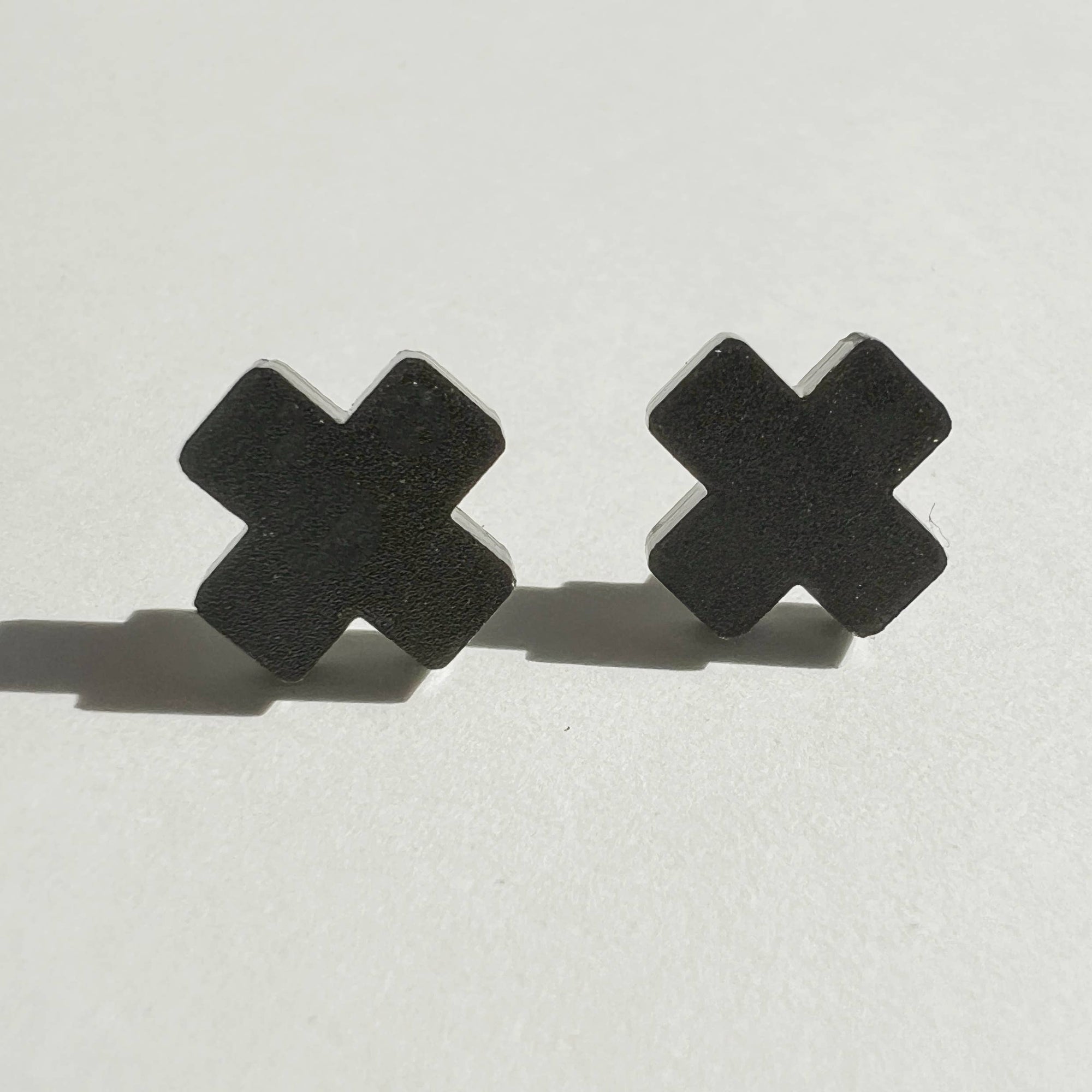 Woman Wearing Mingled Black Cross Stud Earrings - Small Cross Earrings, Minimalist - Earings LUXAMORE