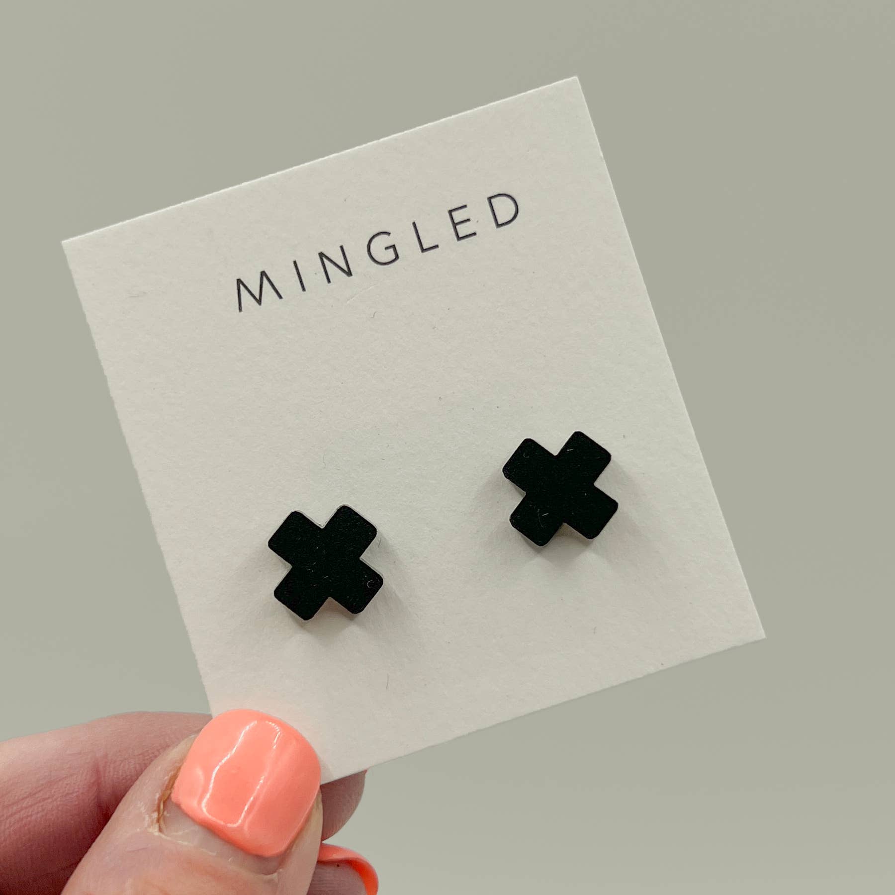 Woman Wearing Mingled Black Cross Stud Earrings - Small Cross Earrings, Minimalist - Earings LUXAMORE