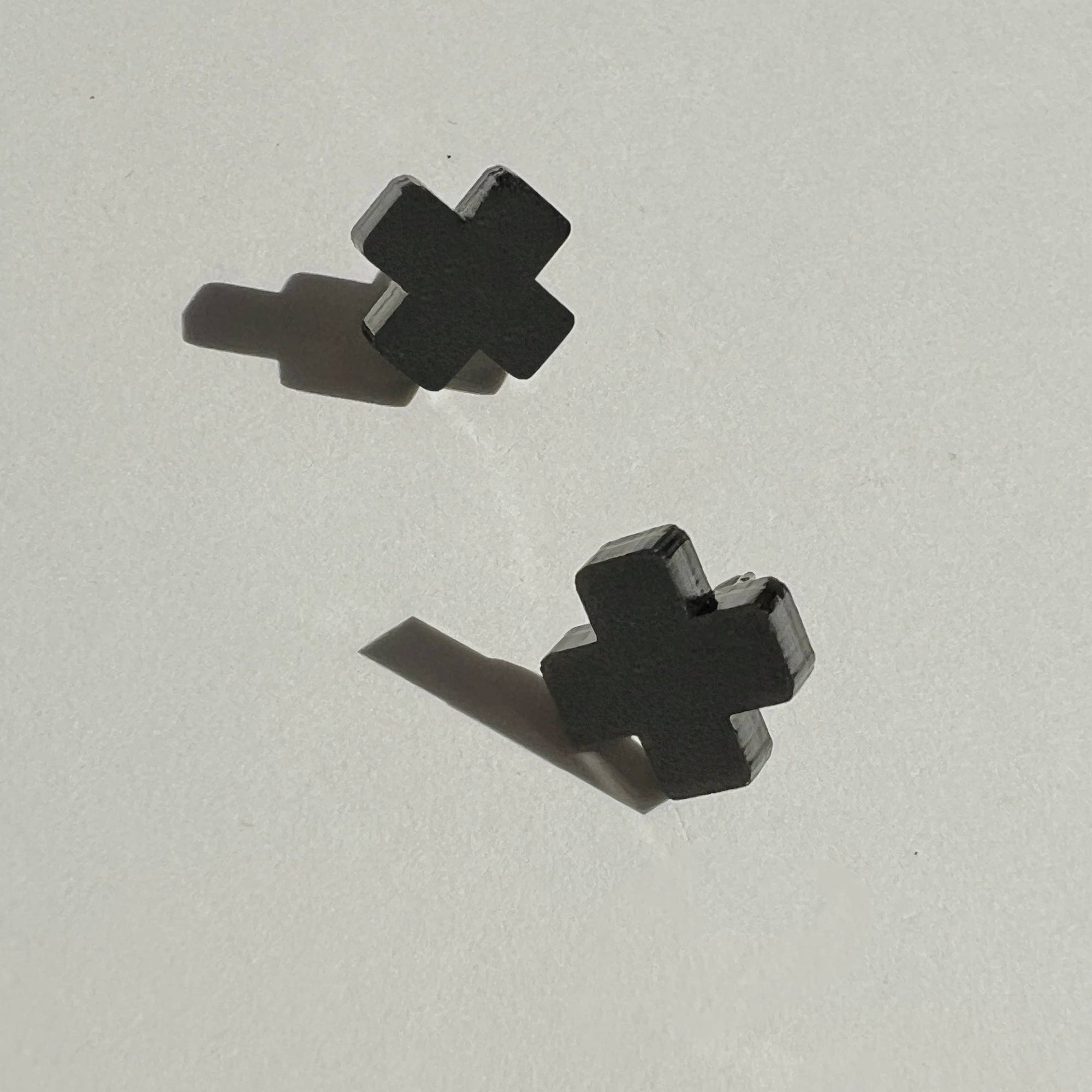 Woman Wearing Mingled Black Cross Stud Earrings - Small Cross Earrings, Minimalist - Earings LUXAMORE