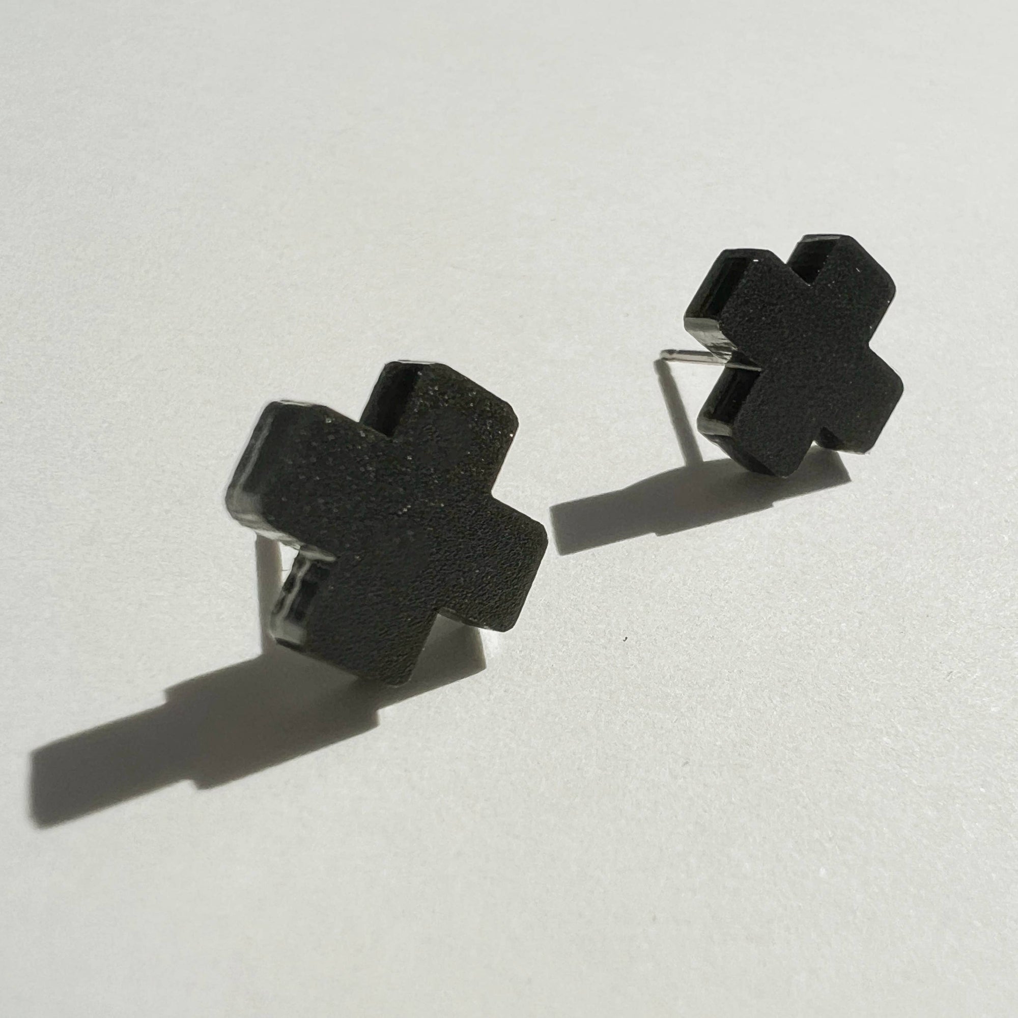 Woman Wearing Mingled Black Cross Stud Earrings - Small Cross Earrings, Minimalist - Earings LUXAMORE
