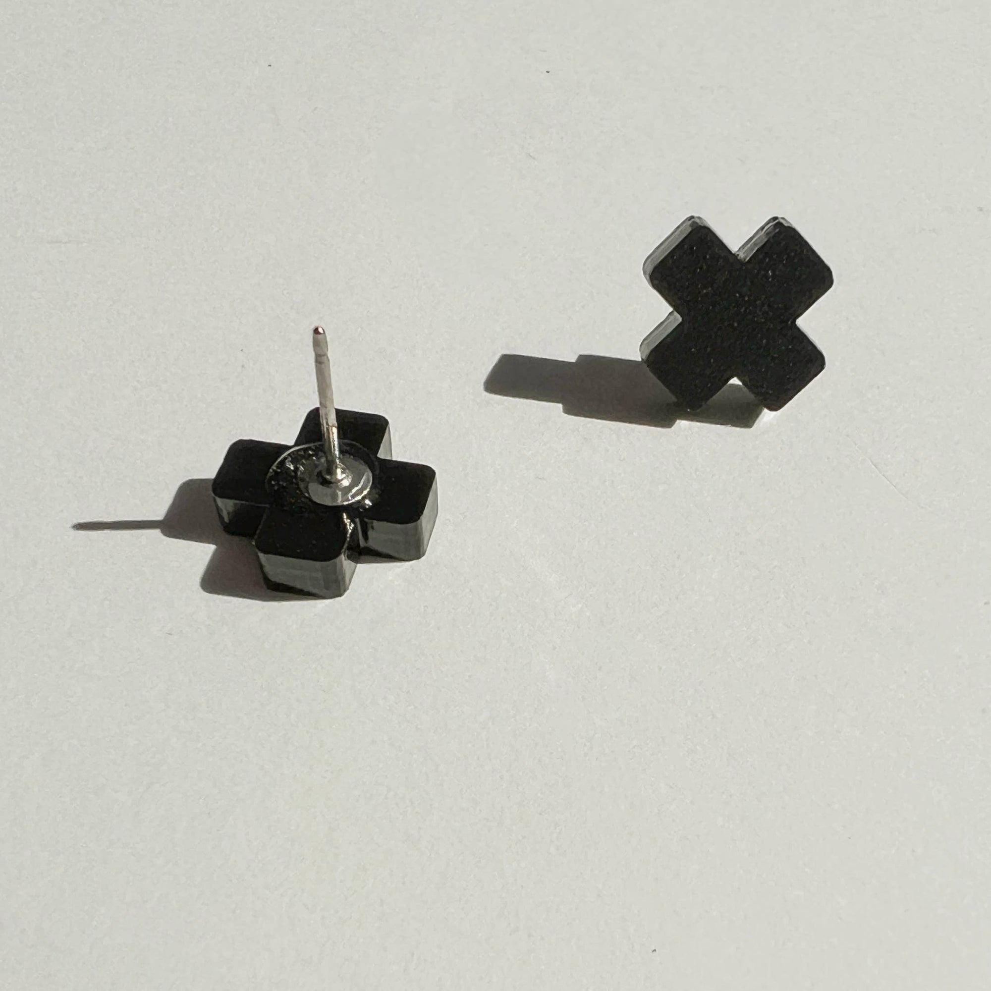Woman Wearing Mingled Black Cross Stud Earrings - Small Cross Earrings, Minimalist - Earings LUXAMORE