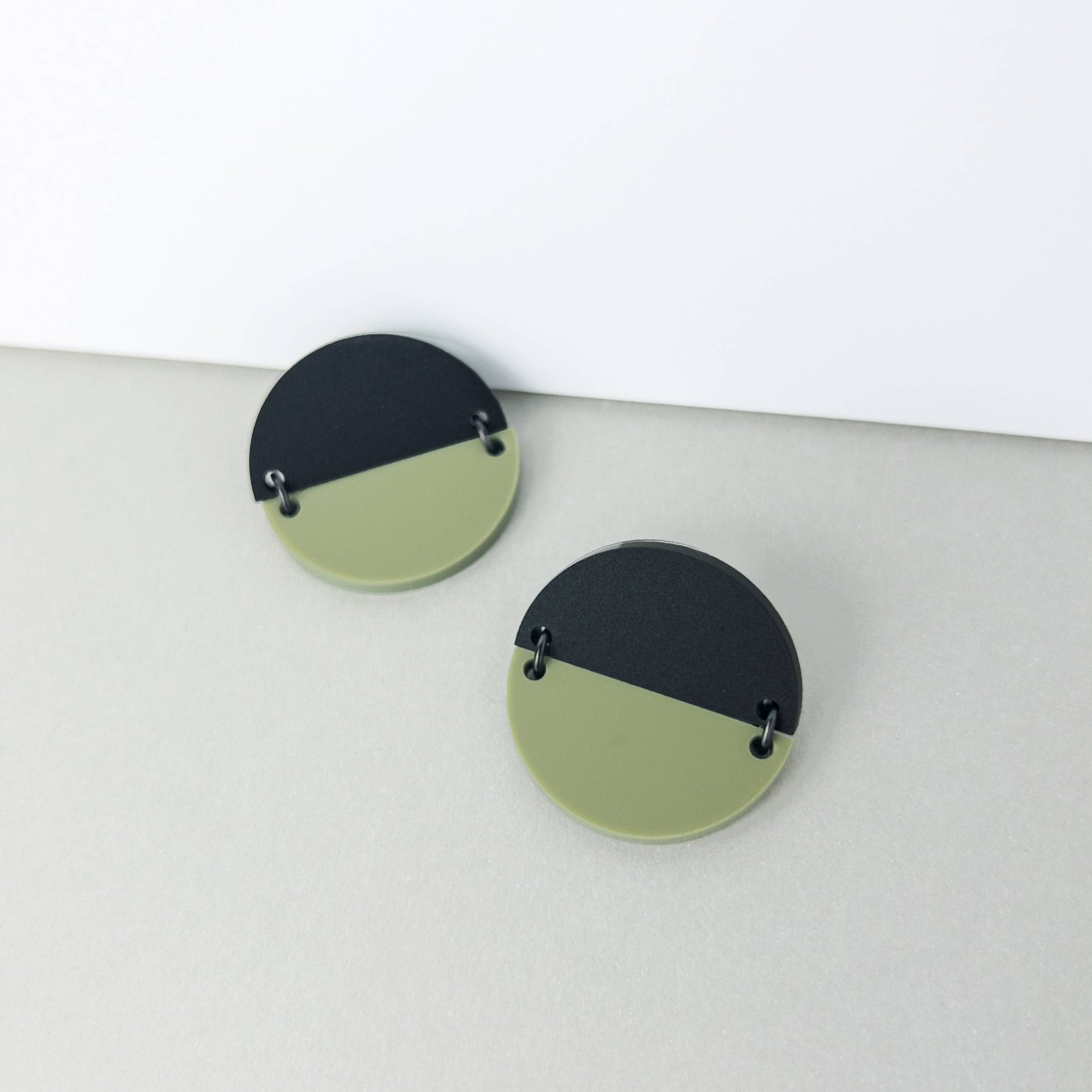 Woman Wearing Mingled Statement Studs in Olive Green and Black -  LUXAMORE