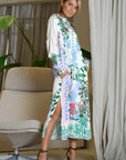 Miss Goodlife Midi Dress Green Garden Made in Italy worn by model in natural setting LUXAMORE 