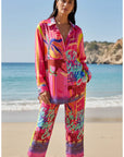 Complete set blouse and trousers Miss Goodlife Pants Sunset Dream in an all-over multicolor print with a wide waistband. LUXAMORE
