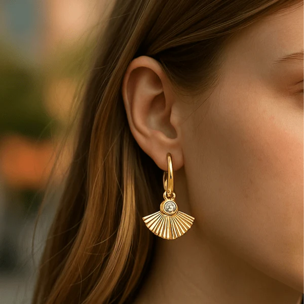 Orna Curio Fan Mail Gold Earrings - LUXAMORE -Earings-Gold Plated Earrings Introducing our Fan Mail Earrings, crafted with 18k gold plating and intricate fan carvings accented by a sparkling cubic zirconia centerpiece. Materials: 18k Gold Plated Stainless Steel Dimensions: 2.8cm x 2cm