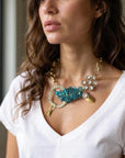 Orna Curio Vintage Bespoke Lagoon Leaf Statement Necklace - LUXAMORE -necklace-One of a Kind – Hand-crafted Necklace This exquisite necklace is a unique blend of vintage and modern elements, hand-crafted in Perth, WA. A symbol of the impeccable beauty and craftsmanship of Orna Curio Jewellery. Measurements: 60cm Adjustable Materials: Vintage Elements with Vintage Gold Plated Alloy