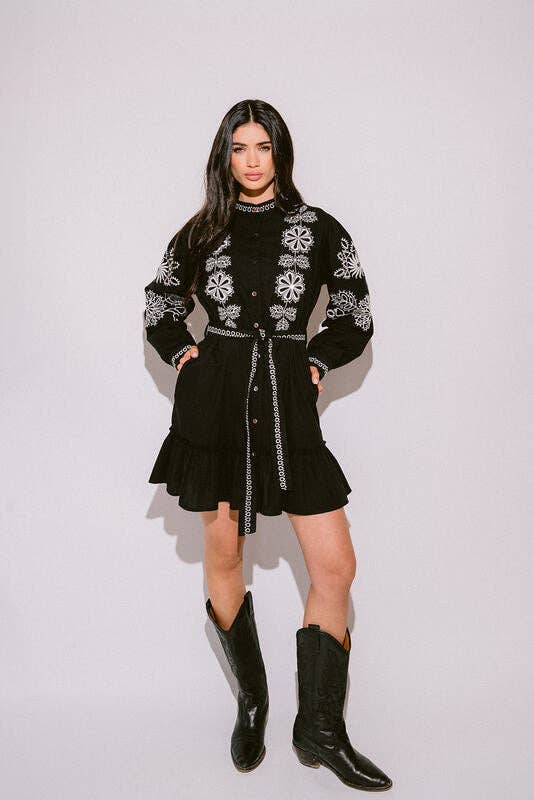 Verona Black & White Short Boho Embroidered Dress worn by model in natural setting LUXAMORE 