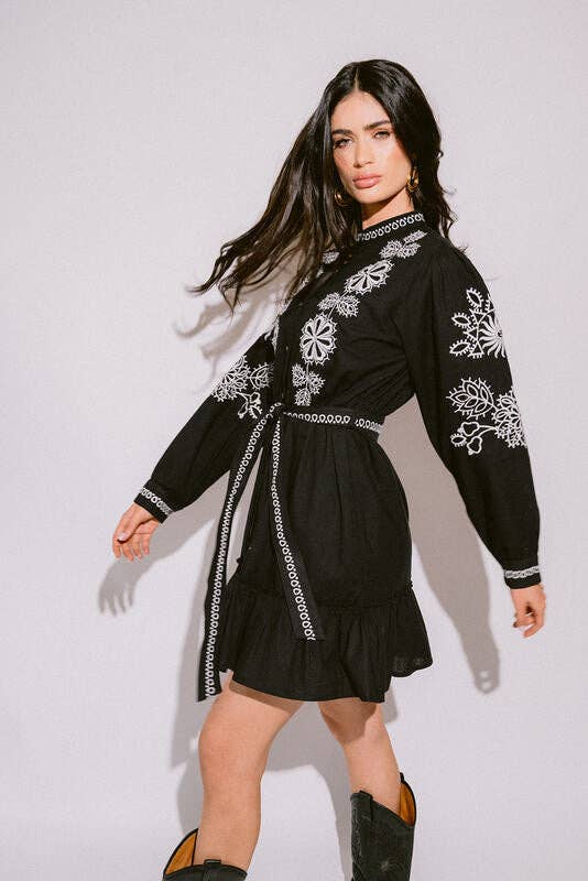 Verona Black & White Short Boho Embroidered Dress worn by model in natural setting LUXAMORE 