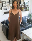 Linen Slip Dress Midi Made in Italy Brown worn by model in natural setting LUXAMORE 