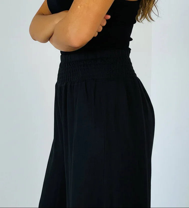 Italian Linen Wide Leg Pants Black - Made in Italy worn by model in natural setting LUXAMORE 