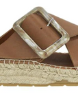 Estilo Emporio Husk Tan Slide - LUXAMORE -Shoes-Estilo Emporio Slide These espadrille slides have been handmade in Spain from vaqueta leather and topped with a tortoiseshell-embellished buckle. They have a platform heel and padded contoured leather footbeds to ensure a comfortable fit. Upper: LeatherInsole: LeatherOutsole: Rubber Height: 3cm Made in Spain
