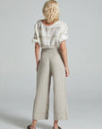 Estilo Emporio Linen Pant Riviera worn by model in natural setting LUXAMORE 